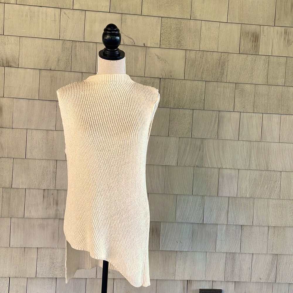 Worth asymmetrical knitted cream tunic.